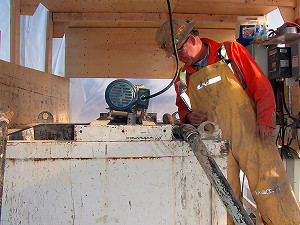Peter White supervising soil mixing at jobsite